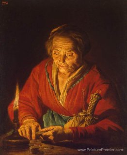 Vieille femme avec une bougie