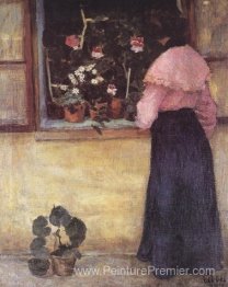 Fille par la fenêtre avec une fleur