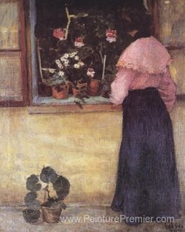 Fille par la fenêtre avec une fleur