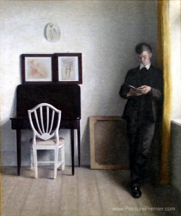 Intérieur avec un jeune homme lisant