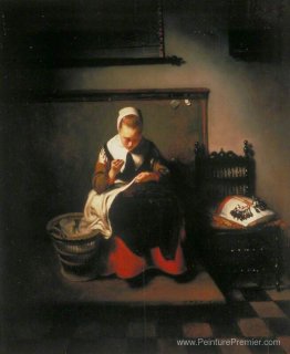 Une jeune femme coudre