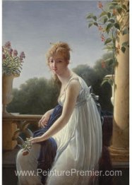 Une jeune femme assise par une fenêtre