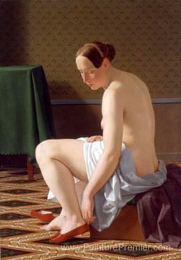 Femme nue en mettant ses pantoufles Femme nue en mettant ses pantoufles