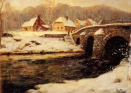 Un pont en pierre sur un ruisseau en hiver Un pont en pierre sur un ruisseau en hiver