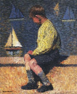 Un garçon avec des voiliers Un garçon avec des voiliers