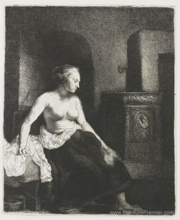 Femme assise à moitié habillée à côté d'un poêle Femme assise à moitié habillée à côté d'un poêle