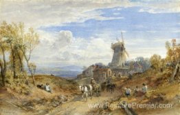 Un moulin à vent par une route de campagne Un moulin à vent par une route de campagne