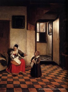 Une femme avec un bébé sur ses genoux et un petit enfant Une femme avec un bébé sur ses genoux et un petit enfant