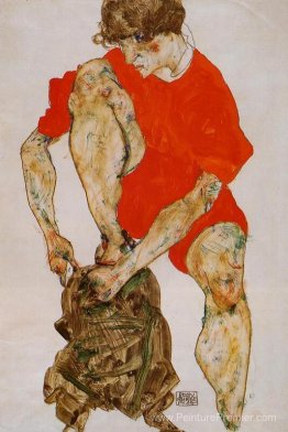 Modèle féminin en veste et pantalon rouge vif Modèle féminin en veste et pantalon rouge vif