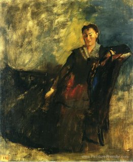 Femme assise sur un canapé Femme assise sur un canapé
