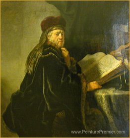 Un savant assis à une table avec des livres Un savant assis à une table avec des livres