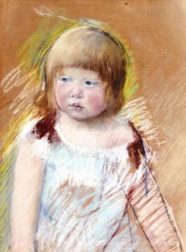 Enfant avec une frange dans une robe bleue Enfant avec une frange dans une robe bleue