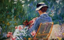 Lydia assise dans le jardin avec un chien sur ses genoux Lydia assise dans le jardin avec un chien sur ses genoux