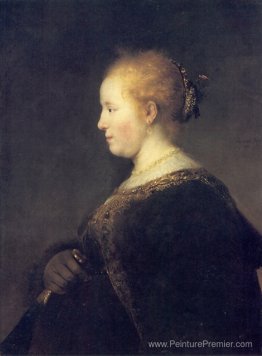 Une jeune femme en profil avec un fan Une jeune femme en profil avec un fan