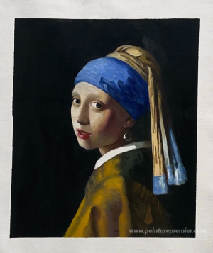 La fille avec une boucle d'oreille perle